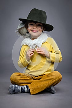 Cheerful little boy with spook, Halloween celebration