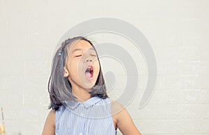 Cheerful little cute girl playing and singing a song, Happy kid concept