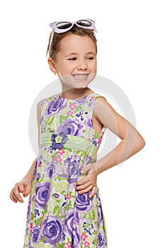 Cheerful little girl looks away