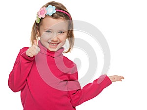 Cheerful little girl in red with her thumb up