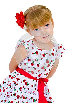 Cheerful little girl with red rose, braided hair