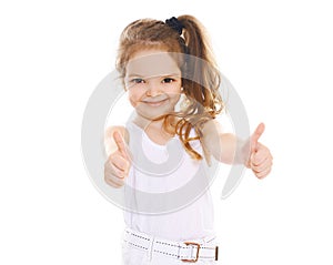 Cheerful little girl showing thumbs up