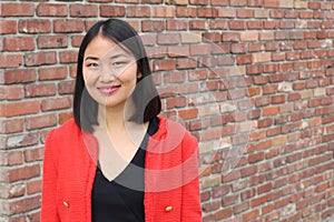 Cheerful looking Asian businesswoman with copy space