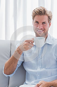 Cheerful man drinking a coffee