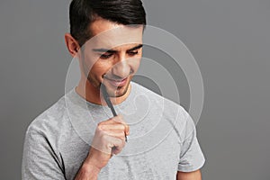 Cheerful man folder for papers holding a pen posing lifestyle Gray background