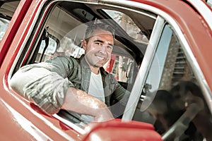 Cheerful man going to drive his car home.