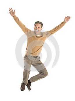 Cheerful Man Jumping Over White Background