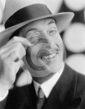 Cheerful man with monocle photo