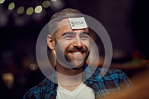 Cheerful Man Playing Guessing Game photo