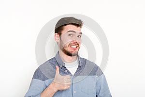 Cheerful man showing like, thumb-up gesture