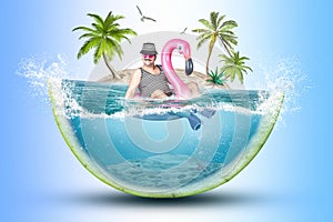 Cheerful man in a striped suit swim in flamingo rubber ring against the background of an island .Collage.