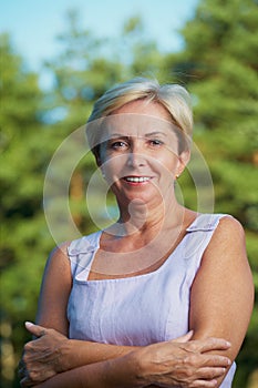 Cheerful mature woman looking at camera