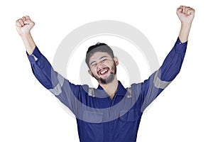 Cheerful mechanic celebrate his success