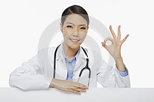 Cheerful medical personnel showing hand gesture