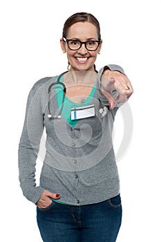 Cheerful medical practitioner pointing at the camera