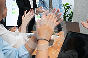 Cheerful meeting room, businesspeople celebrate in meeting room. Habiliment