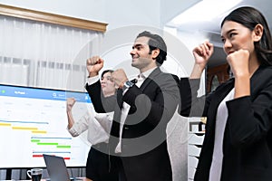 Cheerful meeting room, businesspeople celebrate in meeting room. Habiliment