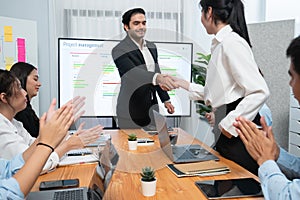 Cheerful meeting room, businesspeople celebrate in meeting room. Habiliment