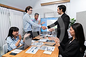 Cheerful meeting room, businesspeople celebrate in meeting room. Habiliment