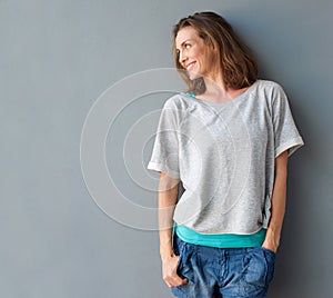 Cheerful mid adult woman smiling and looking to the side