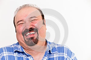 Cheerful middle-aged Caucasian man laughing loud