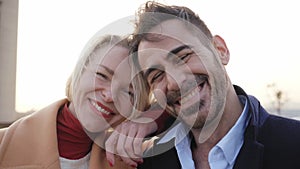 Cheerful middle-aged marriage taking selfie looking at camera. Smiling and happy couple having fun