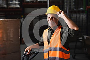 cheerful middle aged warehouse worker in