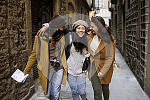Cheerful multi-ethinc group of friends tourists having fun and walking on the streets of Barcelona - Travel, holidays