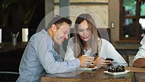 Cheerful multiracial friends taking selfie in pizzeria.