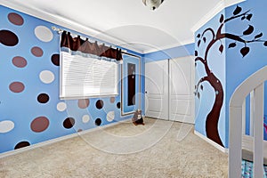 Cheerful murals in baby room.