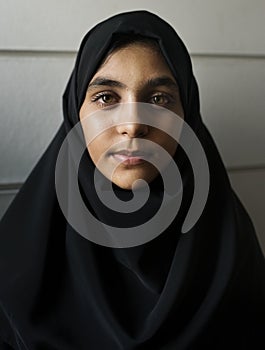 A cheerful Muslim woman closeup