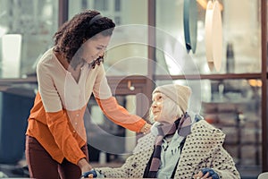 Cheerful nice aged woman feeling very optimistic