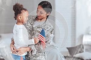 Cheerful nice woman wearing a military uniform