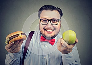 Cheerful obese man choosing diet