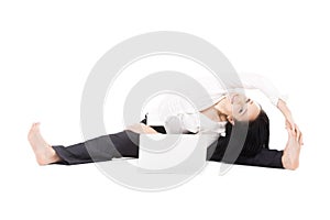 Cheerful office woman with laptop doing yoga pose on white background