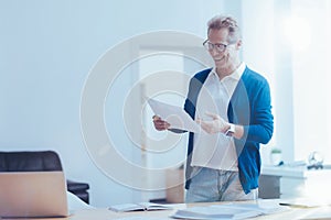 Cheerful office worker working the project