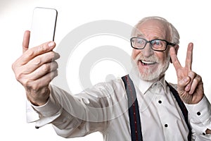 Cheerful old man posing on camera