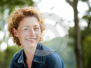 Cheerful older woman smiling outdoors