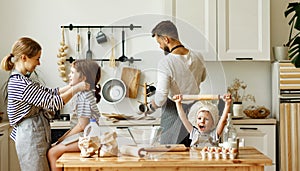 Happy family cooking together at home