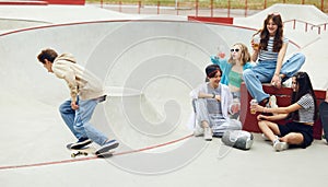 Cheerful people, friends, teens meeting together at skateboard park, having fun, riding on skate, talking