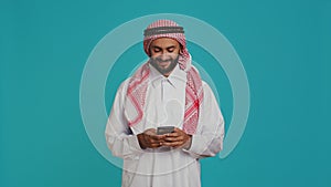 Cheerful person messaging on phone