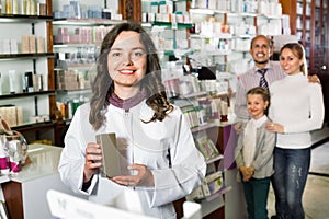 Cheerful pharmacist the pharmaceutical store and consulting cus