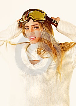 Cheerful and positive. Beautiful winter. Girl in ski or snowboard wear. Happy holidays. Sexy woman in winter clothes