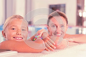 Cheerful positive girl enjoying her time in the pool