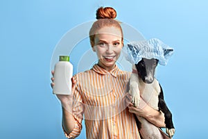 Cheerful positive girl with hairbun preparing for washing process