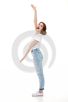 Cheerful pretty caucasian lady standing isolated showing copyspace.