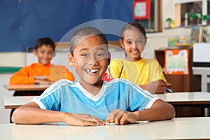 Cheerful primary school children in classroom