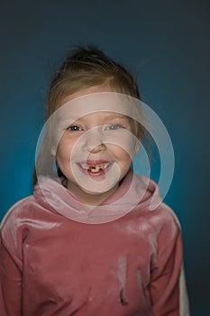 Cheerful red-haired girl without teeth