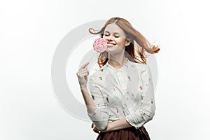 cheerful red-haired woman with a lollipop in her hands emotions open mouth sweets