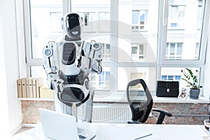 Cheerful robot is enjoying his day job photo